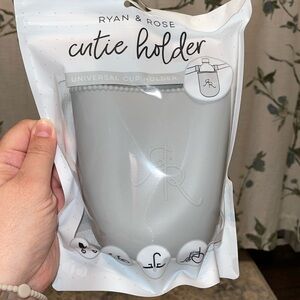 Ryan & Rose Cutie Holder. New in package. Never opened or used. Color: Slate